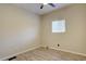 Bright bedroom with a ceiling fan, window and light wood grain floors at 9288 Krashin Dr, Conifer, CO 80433
