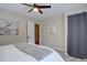 Comfortable bedroom features light gray walls, hardwood floors and an open door at 9288 Krashin Dr, Conifer, CO 80433