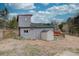 Exterior of home featuring fenced yard and trees at 9288 Krashin Dr, Conifer, CO 80433