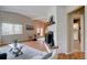 Airy living room with vaulted ceilings, fireplace, wood flooring and outside views from every angle at 9288 Krashin Dr, Conifer, CO 80433