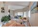 Inviting living room featuring wood floors, a cozy fireplace, and plenty of natural light at 9288 Krashin Dr, Conifer, CO 80433