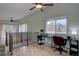 Bright home office features hardwood floors, large window with view, and black metal desk at 9288 Krashin Dr, Conifer, CO 80433
