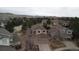 Aerial view of a home nestled within a neighborhood with mature trees at 2805 Masters Ln, Castle Rock, CO 80104