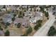 Aerial view of neighborhood featuring mature trees and a home with landscaped yard at 2805 Masters Ln, Castle Rock, CO 80104