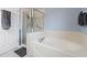 Bright bathroom boasts a soaking tub and a separate shower with a glass door at 2805 Masters Ln, Castle Rock, CO 80104
