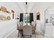 Elegant dining room with a vaulted ceiling and a long wooden table at 2805 Masters Ln, Castle Rock, CO 80104