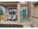 Inviting front porch featuring comfortable seating perfect for relaxing outdoors at 2805 Masters Ln, Castle Rock, CO 80104