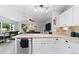 Kitchen featuring a view to the living room, stainless steel appliances, and tile countertops at 2805 Masters Ln, Castle Rock, CO 80104