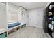 Mud room features storage, bench seating, coat hooks, and a stacked washer and dryer at 2805 Masters Ln, Castle Rock, CO 80104