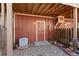 Cozy backyard featuring wooden privacy fence, patio, and access door at 12043 E Ford Cir, Aurora, CO 80012