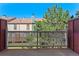 A view from the balcony showing a fenced in yard and other townhomes in the complex at 12043 E Ford Cir, Aurora, CO 80012
