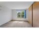 Simple bedroom with window view and ample closet space at 12043 E Ford Cir, Aurora, CO 80012