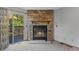 Close up of a stone fireplace with glass doors and a sliding door to the deck at 12043 E Ford Cir, Aurora, CO 80012