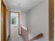 Upstairs hallway with wood railing at 12043 E Ford Cir, Aurora, CO 80012