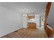 Open floor plan, living room flows into kitchen, with neutral carpet and staircase at 12043 E Ford Cir, Aurora, CO 80012