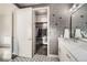 Modern bathroom features a walk-in closet and hexagon floor tile at 15878 E Broncos Pl, Centennial, CO 80112