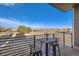 Balcony with a bistro set overlooks the street and offers a scenic view at 15878 E Broncos Pl, Englewood, CO 80112