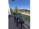Cozy balcony seating area perfect for enjoying city views at 15878 E Broncos Pl, Englewood, CO 80112