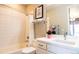 Clean bathroom with modern fixtures and bright vanity lighting at 15878 E Broncos Pl, Englewood, CO 80112