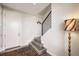 Inviting entryway with modern staircase, stylish lighting and wood floors at 15878 E Broncos Pl, Englewood, CO 80112