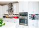 Well-equipped kitchen showcases built-in stainless steel appliances and plenty of counter space at 15878 E Broncos Pl, Englewood, CO 80112