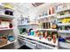 Organized pantry with shelves and drawers, providing ample storage space for food and household items at 15878 E Broncos Pl, Englewood, CO 80112