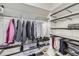 Organized walk-in closet with ample shelving and hanging space, providing convenient storage solutions at 15878 E Broncos Pl, Englewood, CO 80112