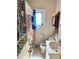 Functional bathroom with a toilet, sink, mirror, and colorful shower curtain at 3953 Vrain St, Denver, CO 80212