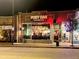Night view of Post Oak Barbecue with large windows showing the interior dining area at 3953 Vrain St, Denver, CO 80212