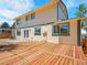 Large, newly refinished wooden deck in a spacious backyard perfect for outdoor entertaining at 8694 E Eastman Ave, Denver, CO 80231