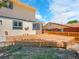 Backyard features an elevated wood deck and a fenced yard at 8694 E Eastman Ave, Denver, CO 80231