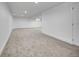 Unfinished basement features neutral walls and carpeted flooring at 8694 E Eastman Ave, Denver, CO 80231