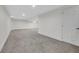 Finished basement with neutral walls and gray carpet at 8694 E Eastman Ave, Denver, CO 80231