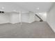 Finished basement featuring plush carpet and stairs at 8694 E Eastman Ave, Denver, CO 80231