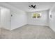 Bedroom features a ceiling fan, carpeted floor, neutral paint, and a window at 8694 E Eastman Ave, Denver, CO 80231