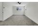 Spacious bedroom featuring carpet, white trim, and a ceiling fan at 8694 E Eastman Ave, Denver, CO 80231