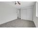 Spacious bedroom with gray carpet, neutral walls, closet, and natural light at 8694 E Eastman Ave, Denver, CO 80231