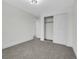 Bedroom with a closet and plush carpet at 8694 E Eastman Ave, Denver, CO 80231