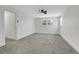 Bright bedroom featuring neutral walls, plush carpet, ceiling fan and large windows for natural light at 8694 E Eastman Ave, Denver, CO 80231