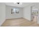 Modern dining room with updated flooring, contemporary light fixture, and large window at 8694 E Eastman Ave, Denver, CO 80231