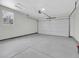Clean, empty garage with a window and automatic door opener at 8694 E Eastman Ave, Denver, CO 80231