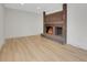 Cozy living room showcasing a brick fireplace at 8694 E Eastman Ave, Denver, CO 80231