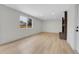 Bright living room featuring wood floors, a brick fireplace and an abundance of natural light at 8694 E Eastman Ave, Denver, CO 80231