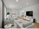 Bright living room featuring neutral furniture, a large window, and recessed lighting at 8694 E Eastman Ave, Denver, CO 80231
