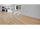 Open-concept living area showcases updated kitchen and access to backyard at 8694 E Eastman Ave, Denver, CO 80231