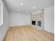 Room with fireplace, recessed lighting, and wood flooring at 8694 E Eastman Ave, Denver, CO 80231
