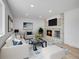 Living room featuring a fireplace, sofa, armchair, and stylish decor at 8694 E Eastman Ave, Denver, CO 80231