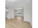 Open-concept living space featuring wood floors, recessed lighting, and white trim at 8694 E Eastman Ave, Denver, CO 80231