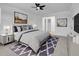 Well-lit primary bedroom with carpet, ceiling fan, and tastefully decorated at 8694 E Eastman Ave, Denver, CO 80231