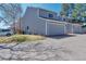 Two-story house showing grass, driveway, and other units at 12561 E Cornell Cir, Aurora, CO 80014